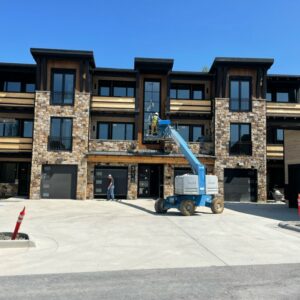 Condos in Montana with a Genie lift in front